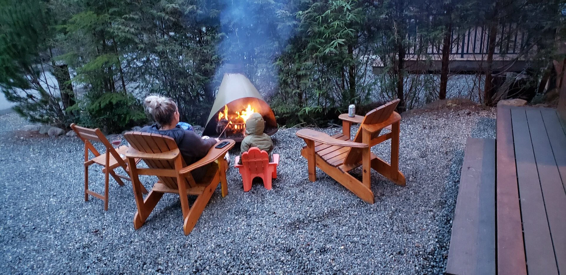 Outdoor fire pit at Rachael's Retreat cedar cabin in Port Renfrew BC at evening